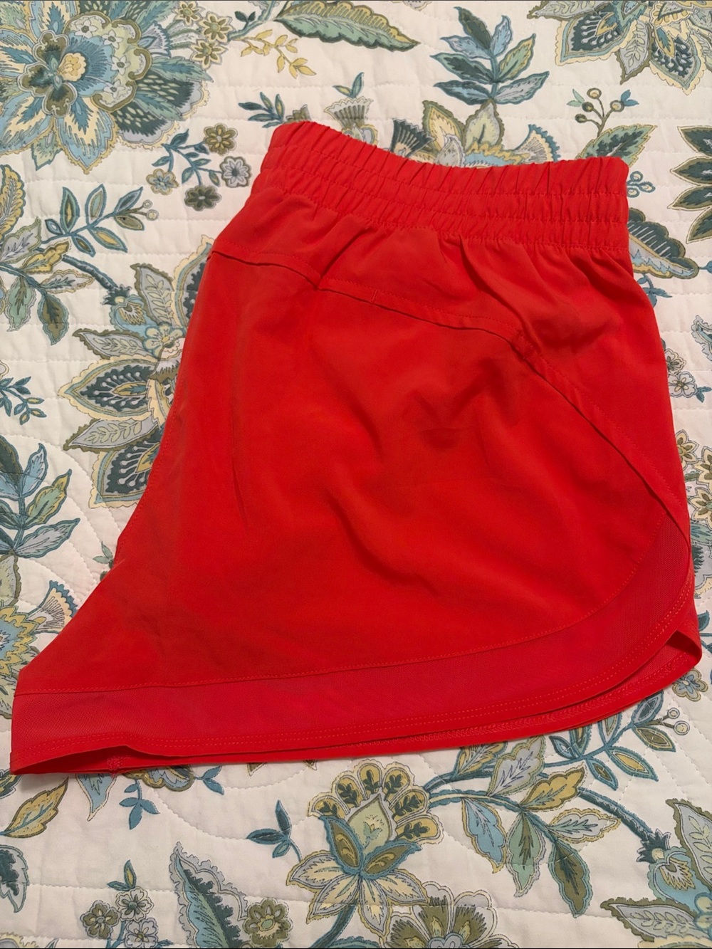 NWOT Asics orange workout shorts, size L.
